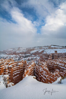 Standing at the edge of Bryce Canyon covered in fresh powder. 