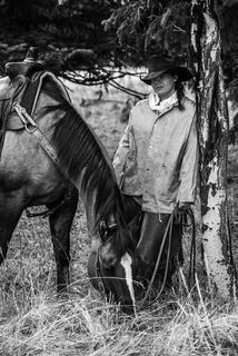 Cowgirl waiting out the rain.