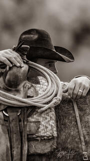 Cowboy Looking over saddle