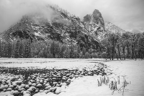 Snow pebbles in the stream.