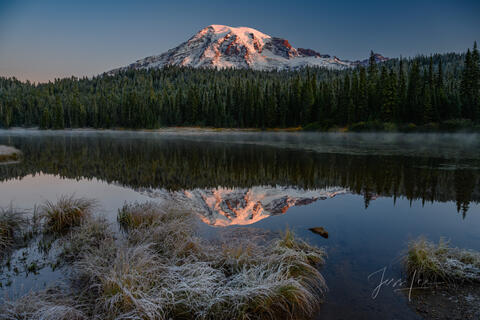Mount Rainier photo with reflection lake and frosty grass.