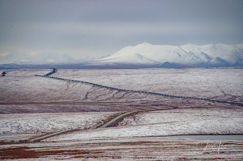 Road cutting through Arctic tundra in Alaska 