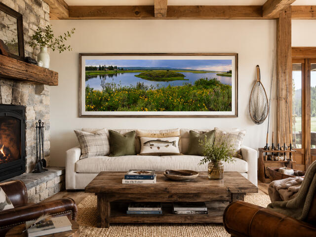 Henry's Fork Railroad Ranch panoramic fine art print above a sofa in a fly fishing living room, by Jess Lee