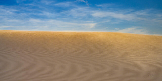 Panoramic fine art photography print of the expansive white gypsum sand dunes at White Sands National Park, New Mexico, featuring a wide-angle view.