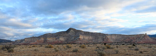 Panoramic fine art photography by Jess R. Lee of layered desert cliffs and valleys in the Rio Puerco region of New Mexico.
