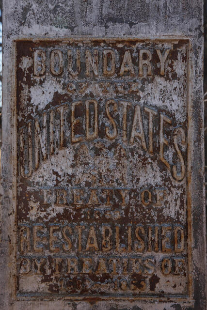 Historical fine art photograph by Jess R. Lee of a rusted "Boundary of the United States" treaty marker sign in New Mexico.