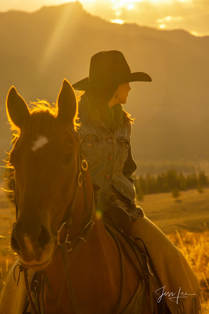 Wyoming Cowgirl looking back into the autumn afternoon.