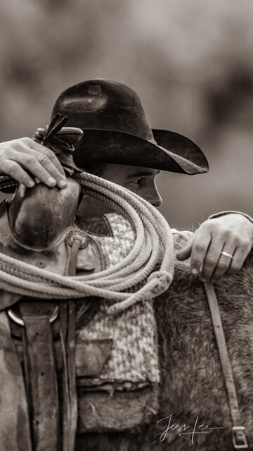 Cowboy Looking over saddle
