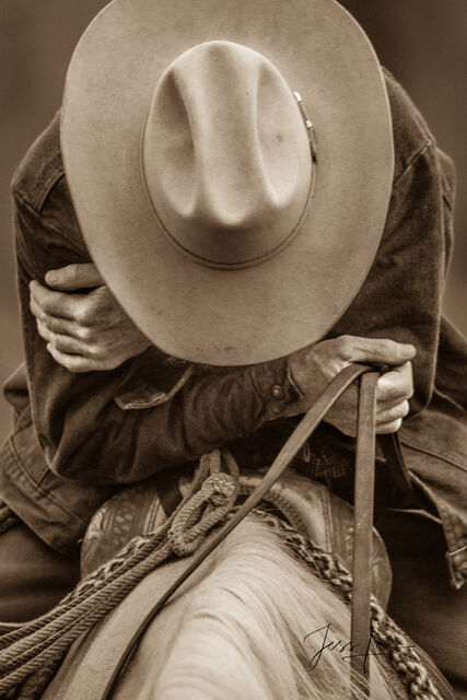 Wyoming Cowboy resting on his saddle.