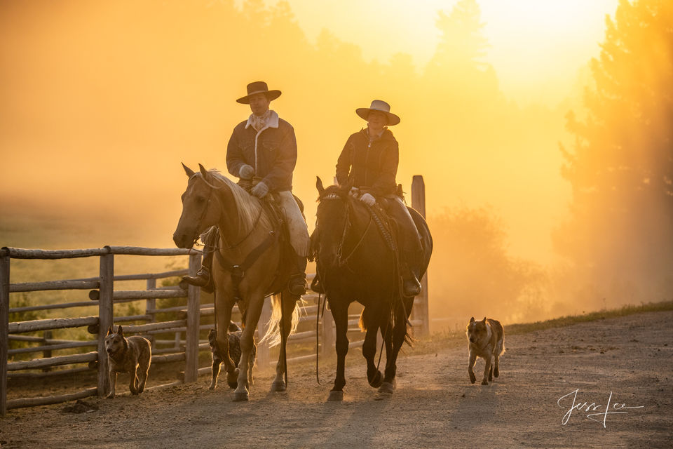 Cowboy and Cowgirl Riding at Sunrise 