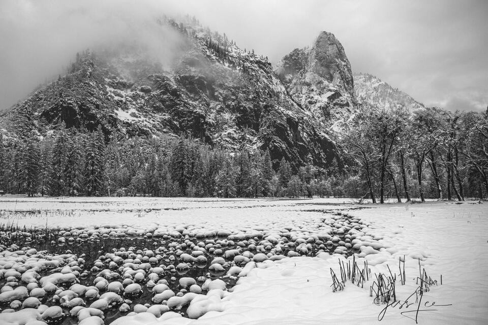Snow pebbles in the stream. print