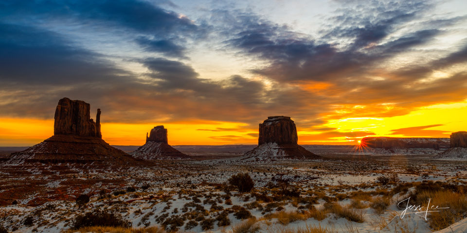 Sunrise in Monument Valley casts beautiful colors over the vast landscape. 