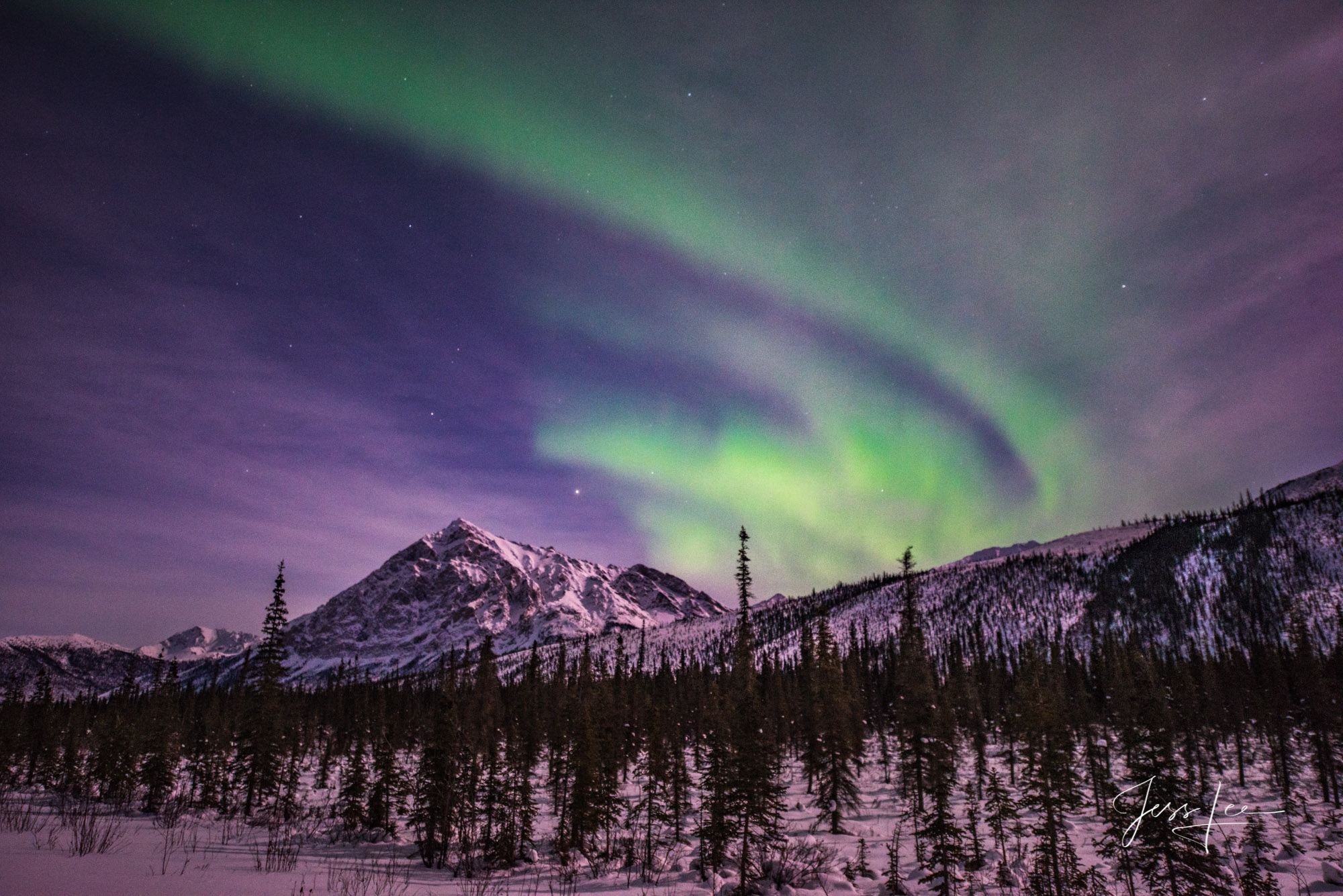 Aurora Borealis making waves over the Alaskan landscape. 
