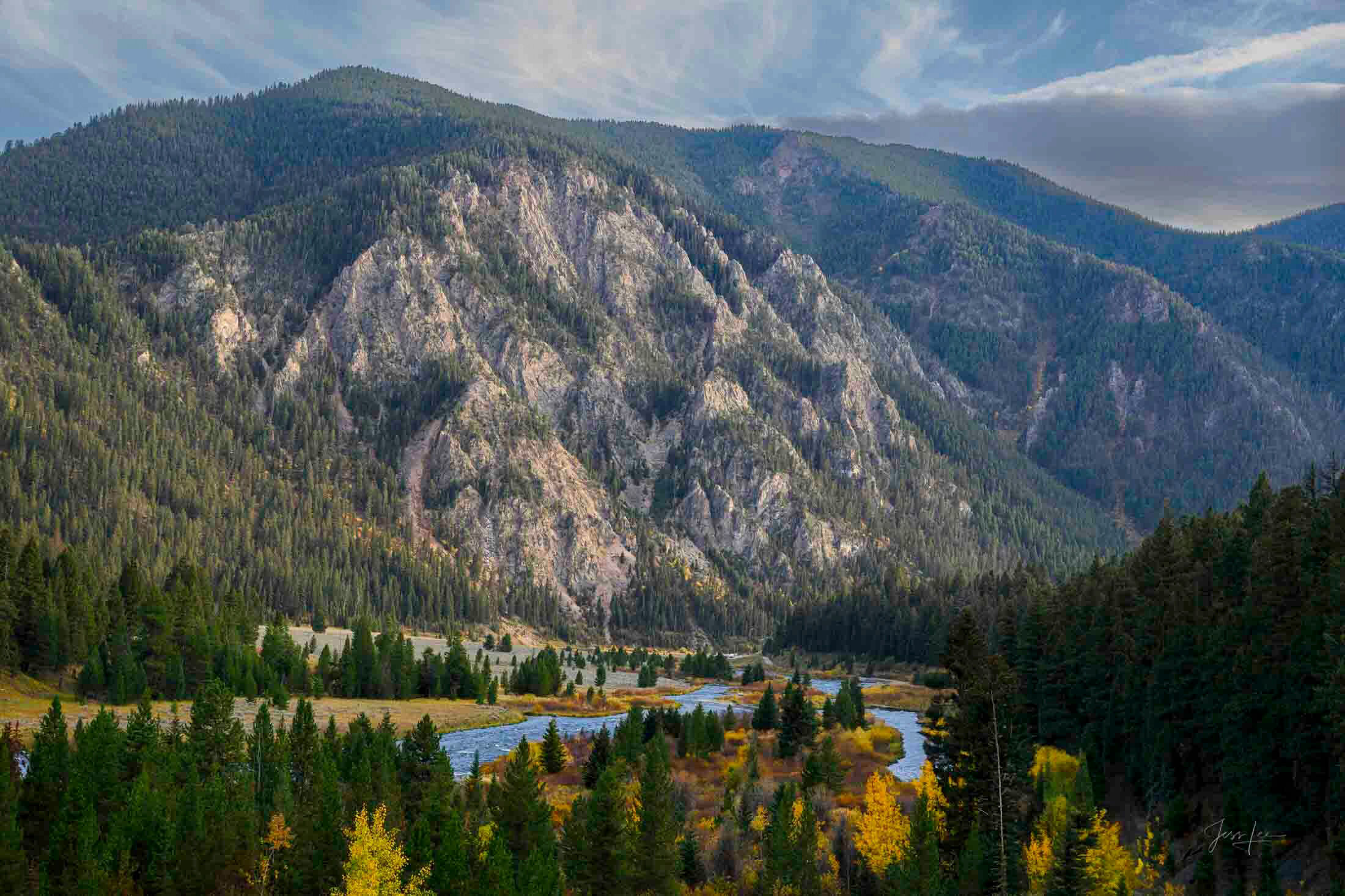 Between the Lakes — Madison River, Montana in Autumn Madison River threading through forested valley below massive granite buttress, autumn color beginning, Montana — fine art landscape print by Jess Lee