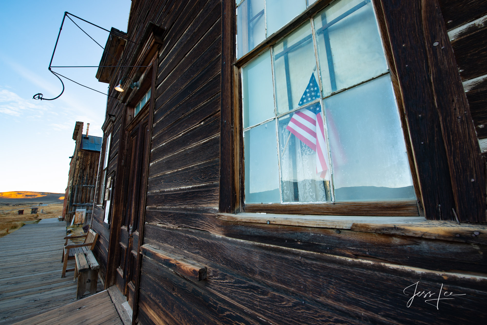 Flag in the window of an old store in Bodie, California 