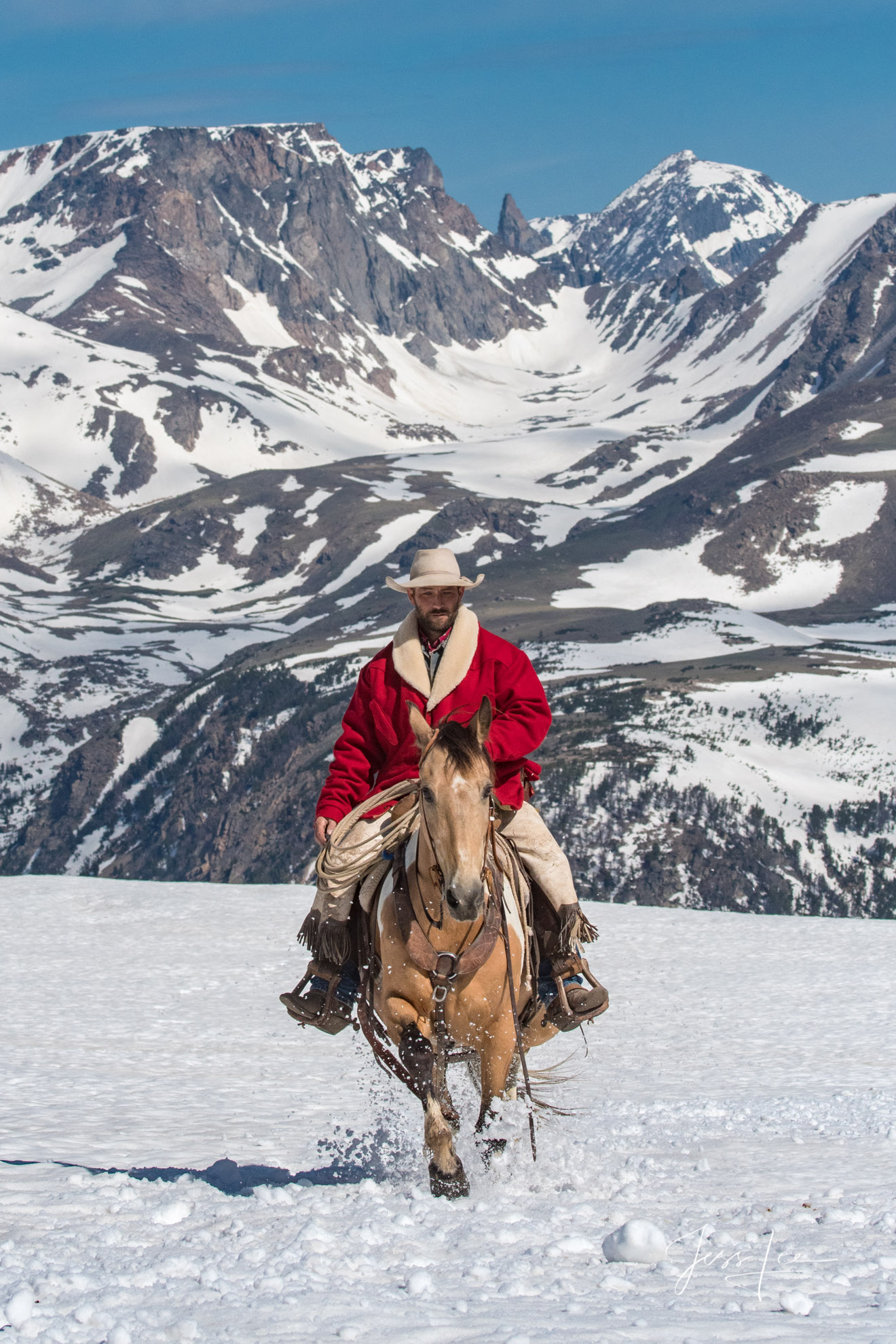 Fine Art Limited Edition Photography of Cowboys, Horses and life in the West. Wyoming cowboy riding in spring snow on the Beartooth...
