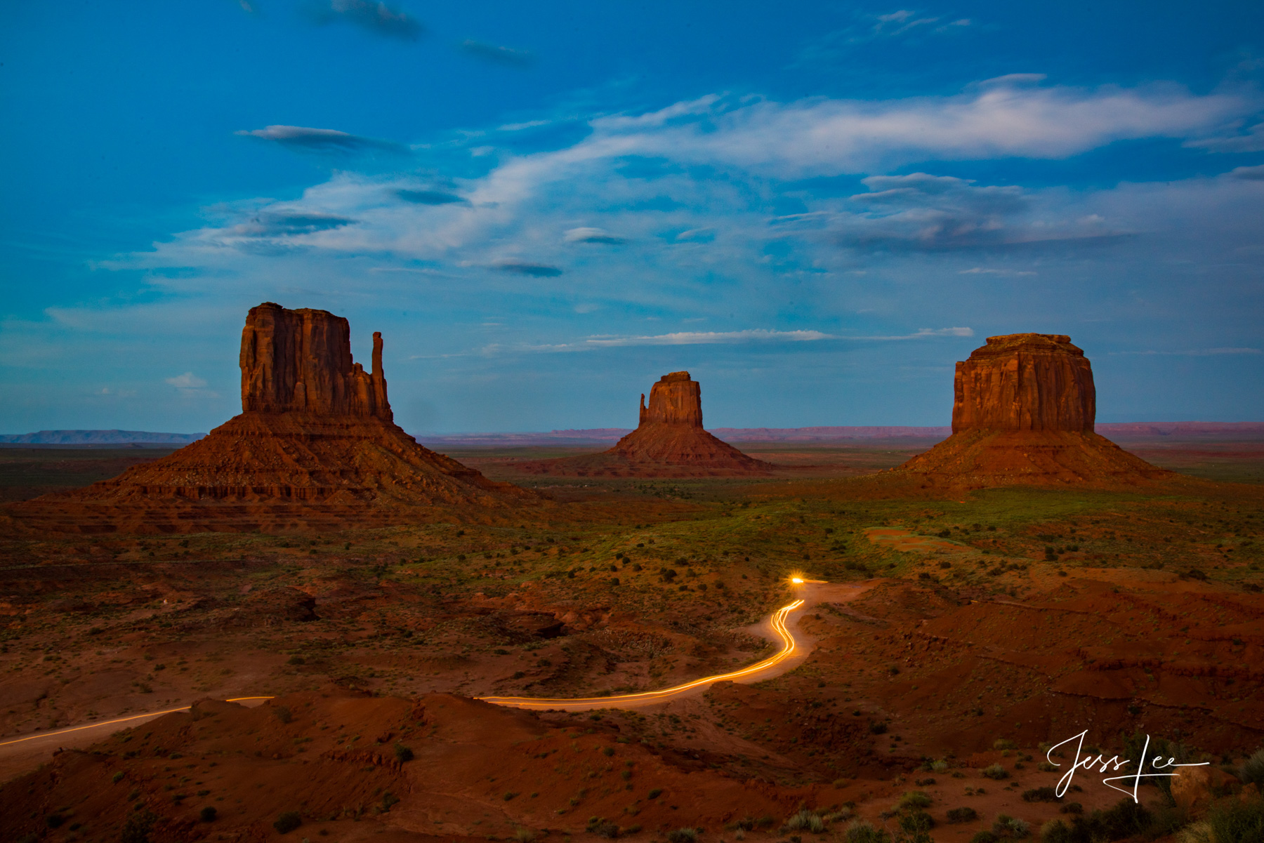 Streak of light from evening traffic in Monument Valley, Arizona. 