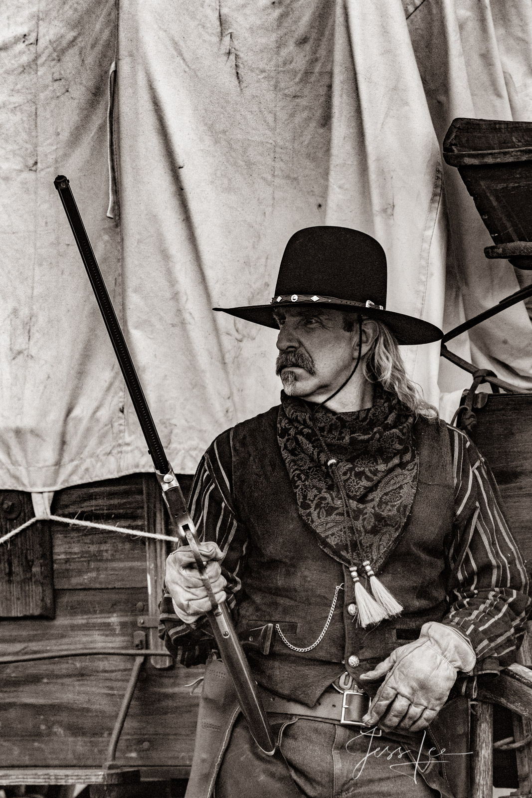 Rifleman and Wagon Old Time Cowboy Black and White Sepia Print. Plainsman with Henry Rifle at wagon.