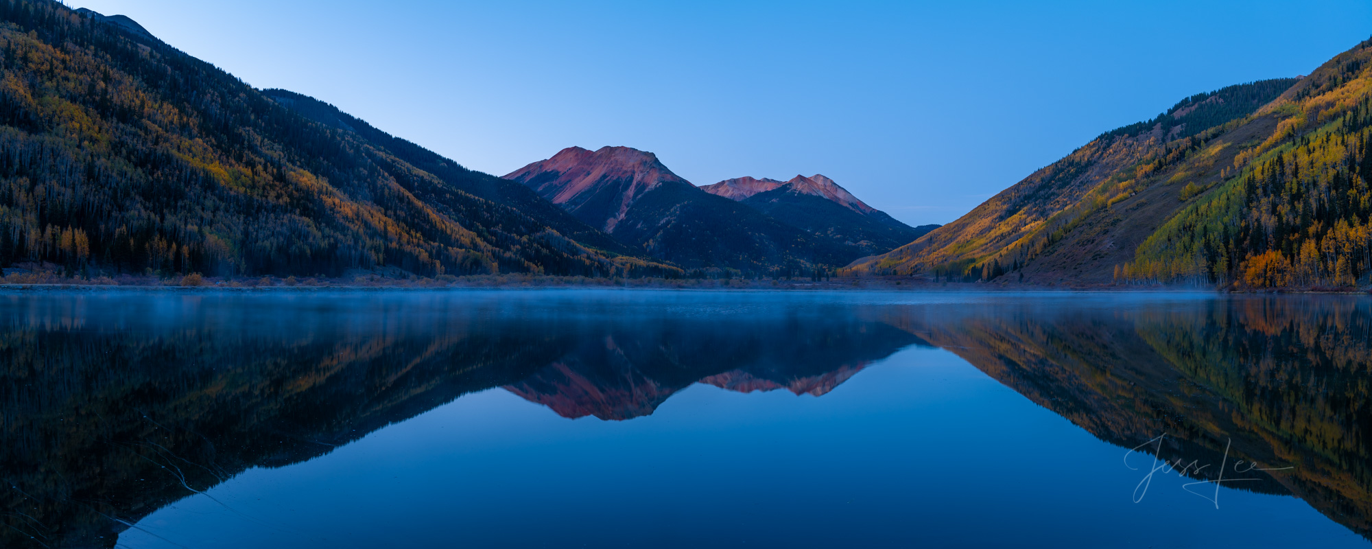 A Colorado Fall Color Panoramic Print of Crystal Lake reflection at sunrise during the peak of Autumn Color in southeast Colorado...