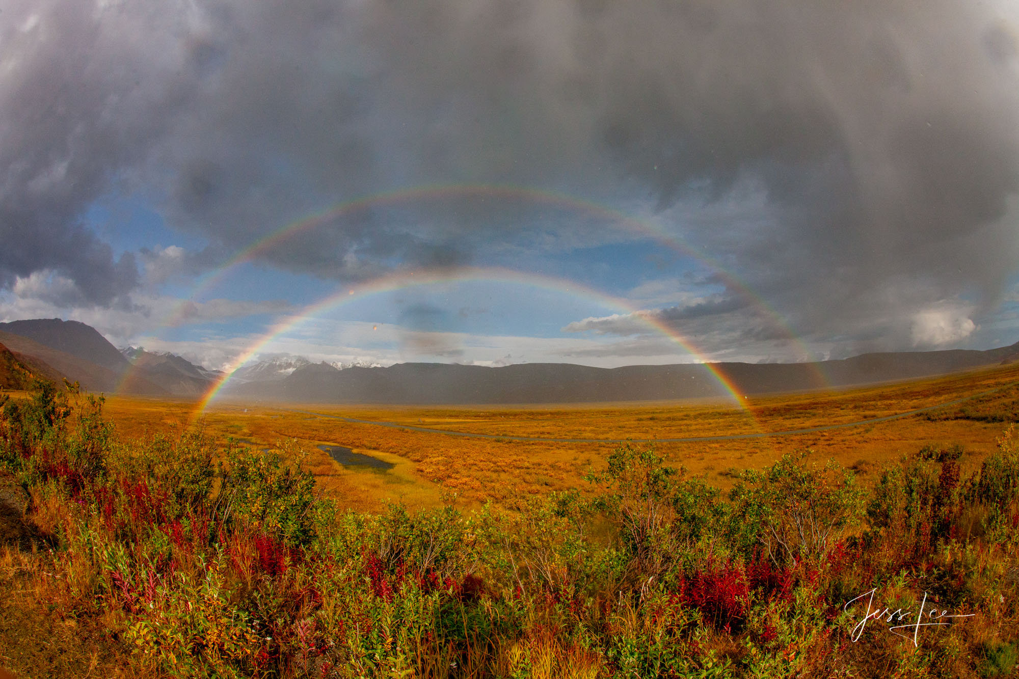 A double rainbow stretching across the Alaskan tundra. 